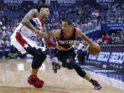 Portland guard C.J. McCollum drives to the hoop on against Washington.