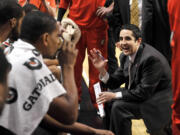 Portland Trail Blazers head coach Kaleb Canales talks to his team during a timeout in the first quarter of an NBA basketball game against the Chicago Bulls, Friday, March 16, 2012, in Chicago.