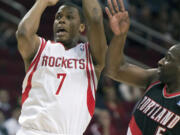 Houston Rockets' Kyle Lowry (7) shoots over Portland Trail Blazers' Raymond Felton (5) during the first quarter Saturday.