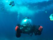 A group of people explore waters off the Seychelles islands in a submersible sightseeing capsule in December, an excursion offered to passengers aboard the Crystal Cruises yacht Crystal Esprit. The glass pod carries two people plus a captain, and the 30-minute ride is $599 a person.