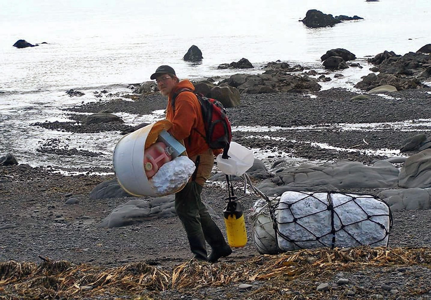 In this June 6, 2012 photo provided by Ryan Pallister, Patrick Chandler removes tsunami debris on Montague Island near Seward, Alaska. More than a year after a tsunami devastated Japan, killing thousands of people and washing millions of tons of debris into the Pacific Ocean, neither the U.S. government nor some West Coast states have a clear plan for how to clean up the rubble that floats to American shores.