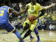 Oregon's Dwayne Benjamin, takes a step towards the basket during the first half of an NCAA college basketball game against UCLA Saturday, Jan. 23, 2016, in Eugene, Ore.