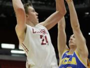 Washington State's Josh Hawkinson (24) shoots against UCLA's Thomas Welsh (40) during the first half of an NCAA college basketball game, Sunday, Jan. 3, 2016, in Pullman, Wash.