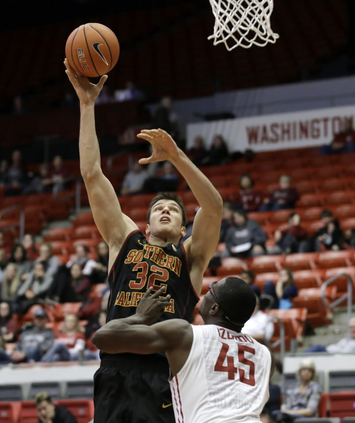 Southern California forward Nikola Jovanovic puts up a shot over Washington State center Valentine Izundu (45) in the second half of an NCAA college basketball game, Friday, Jan. 1, 2016, in Pullman, Wash. Jovanovic had 20 points as to lead Southern California to a 90-77 win over Washington State.(AP Photo/Ted S.