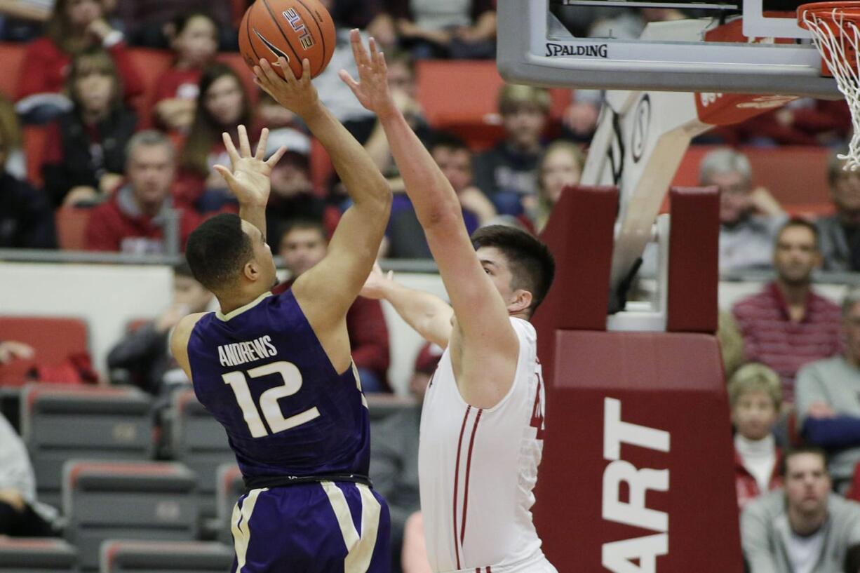 Washington's Andrew Andrews (12) shoots against Washington State's Conor Clifford during the first half of an NCAA college basketball game, Saturday, Jan. 9, 2016, in Pullman, Wash.