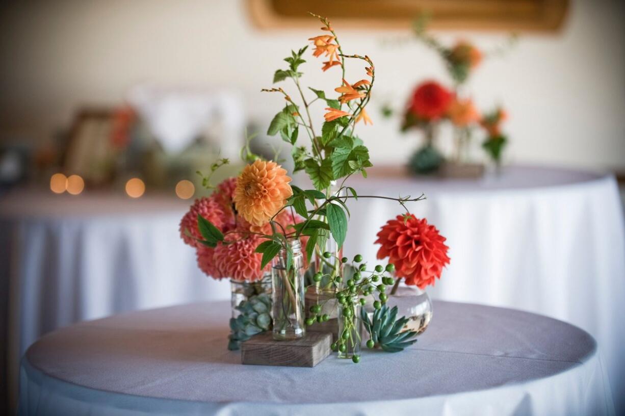 Kelly Sullivan of Botanique designed this centerpiece with flowers and succulents. Most wedding florists recommend sprinkling succulents among traditional flowers, rather than an all-succulent bouquet, which can get heavy and bulky looking. Their vibrant green and sometimes purple colors pair especially well with jewel tones, burgundy and apricot shades.