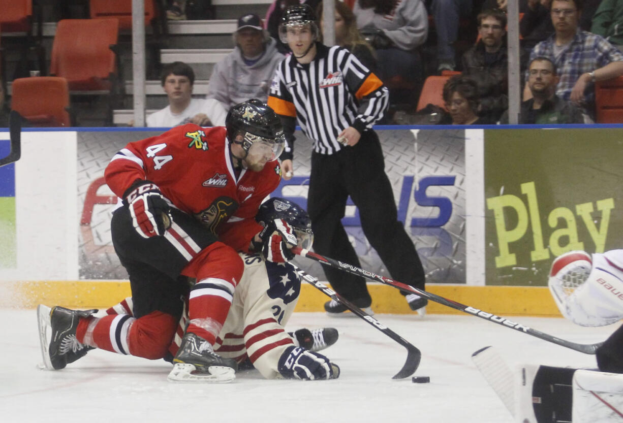 Portland's William Wrenn shuts down an attack by Tri-City's Brian Williams on April 20 during the first game of the Western Conference finals between the Tri-City Americans and the Portland Winterhawks at the Toyota Center in Kennewick, Washington Friday April 20, 2012.