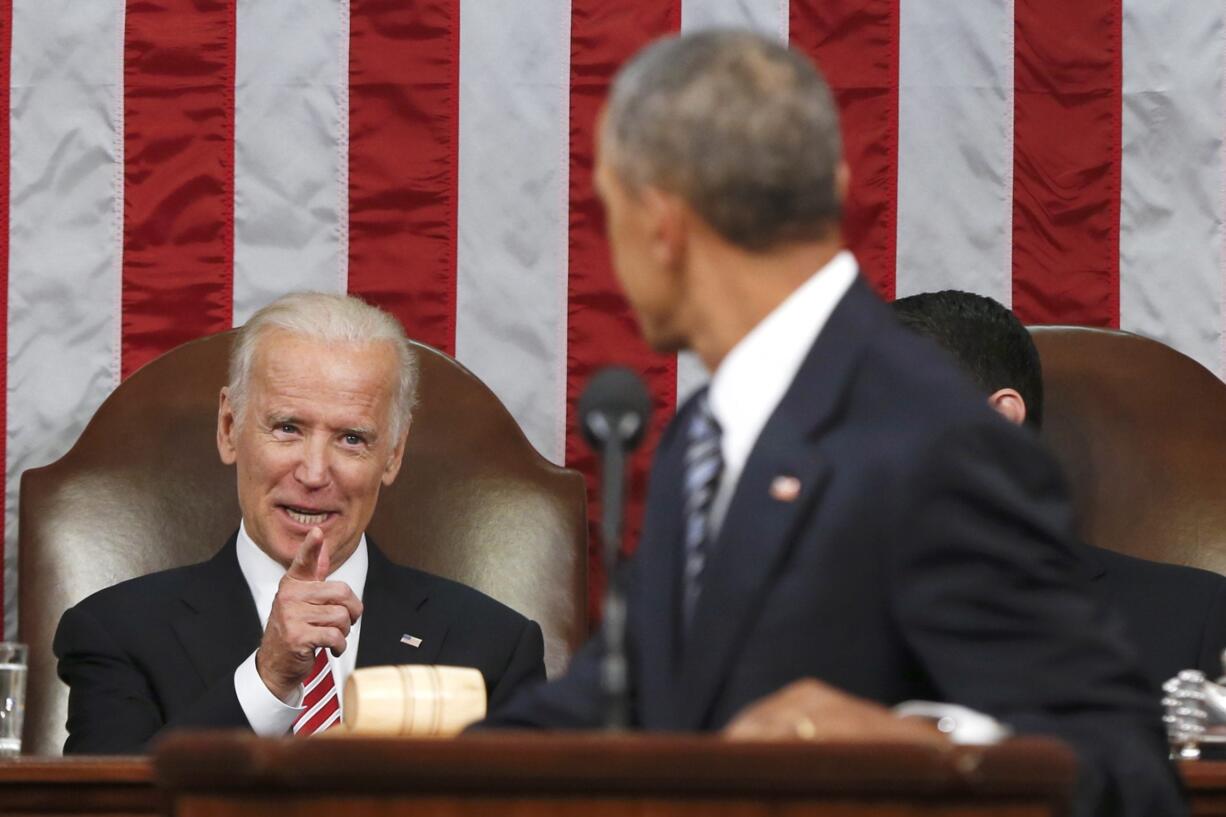 Vice President Joe Biden points at President Barack Obama during the president&#039;s State of the Union address to a joint session of Congress on Capitol Hill in Washington. President Barack Obama is creating a new federal task force to accelerate cancer research. He&#039;s tapping Biden to chair the effort.