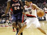 Portland Trail Blazers forward Nicolas Batum (88) works against Atlanta Hawks forward Marvin Williams during the second half Saturday.