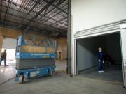 Joe Pauletto, right, stands inside the walk-in refrigerator while giving a tour of the site of the new Clark County Food Bank on September 30. It is still under construction, but scheduled to open before the end of the year.