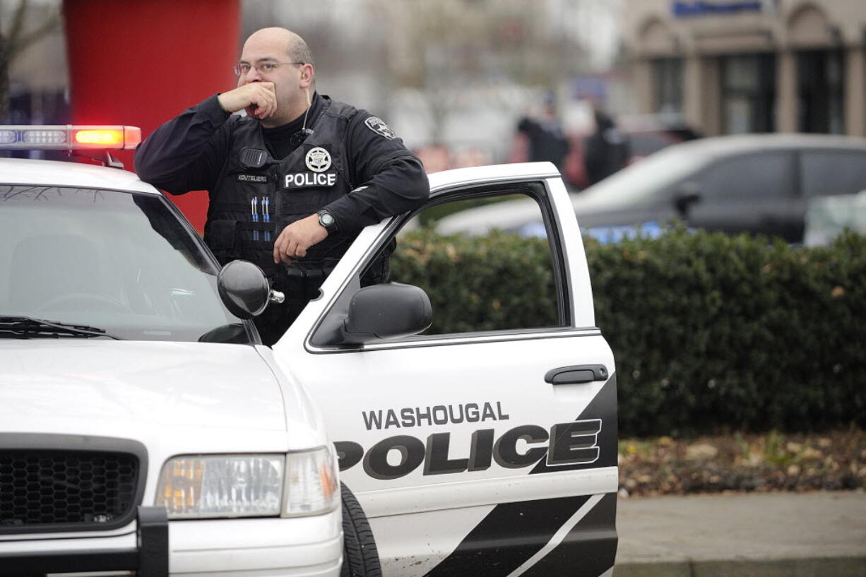 A Washougal Police officer responds to a house fire and standoff on Dec. 7. Investigators later determined that Steven Stanbary shot his wife and her sister before burning down his home with all three of them in it.