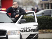 A Washougal Police officer responds to a house fire and standoff on Dec. 7. Investigators later determined that Steven Stanbary shot his wife and her sister before burning down his home with all three of them in it.