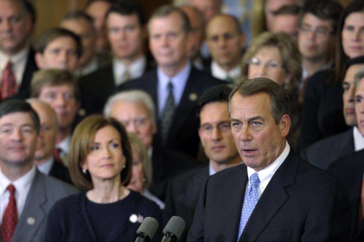 House Speaker John Boehner of Ohio, surrounded by his colleagues, speaks during a news conference on Capitol Hill in Washington, Tuesday. The House rejected a plan backed by President Barack Obama to extend a 2 percentage point payroll tax cut for two months to buy time for talks on a full-year renewal.