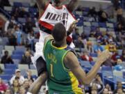 Portland Trail Blazers guard Jamal Crawford shoots over New Orleans Hornets Trevor Ariza in the second half Friday at New Orleans.