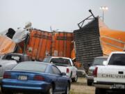 Trailers lay smashed atop one another after a tornado reportedly tore through the southeastern portion of Dallas County, Texas, Tuesday, near Lancaster, Texas.