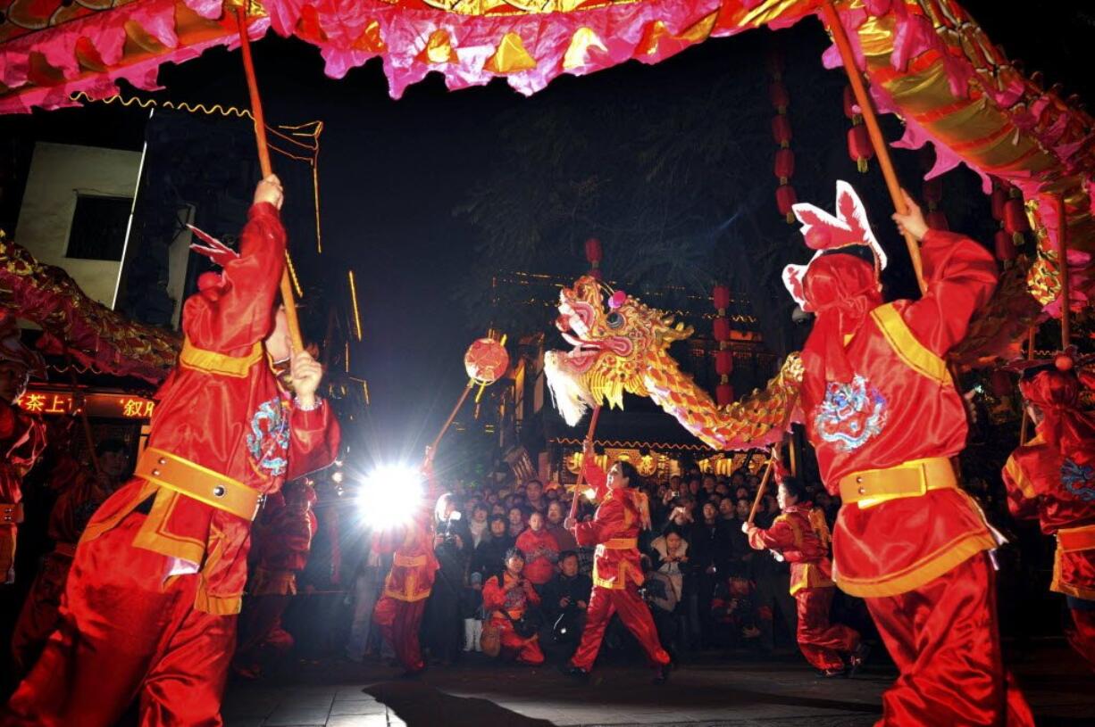 A crowd watches a dragon dance Feb. 6 to celebrate the Lantern Festival in Chengdu, in southwestern China's Sichuan province.