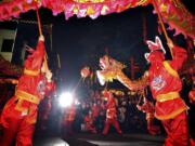 A crowd watches a dragon dance Feb. 6 to celebrate the Lantern Festival in Chengdu, in southwestern China's Sichuan province.