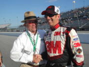 Roush Racing team owner Jack Roush, left, congratulates Greg Biffle after Biffle won the pole during qualifying for the NASCAR Sprint Cup Southern 500.