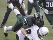 Portland State linebacker AJ Schlatter (31) tackles Montana wide receiver Ben Roberts.