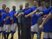 The Vancouver Volcanoes pose with their 2011 IBL Championship rings before their game against the Bellingham Slam at Clark College on Friday.