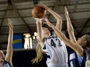 Skyview's Katie Swanson shoots over Gonzaga Prep defenders at the 4A state basketball tournament in Tacoma on Friday.