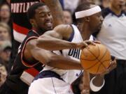 Portland Trail Blazers guard Wesley Matthews knocks the ball loose from Dallas Mavericks guard Jason Terry during the first half Saturday.