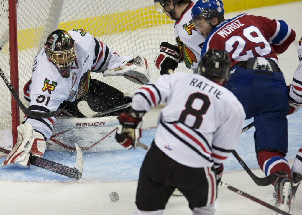 The Portland Winterhawks goalie Mac Carruth plays the puck as the Edmonton Oil Kings make a rush in the third period of game 3 in the WHL Finals at the Rose Garden on Sunday May 6, 2012.