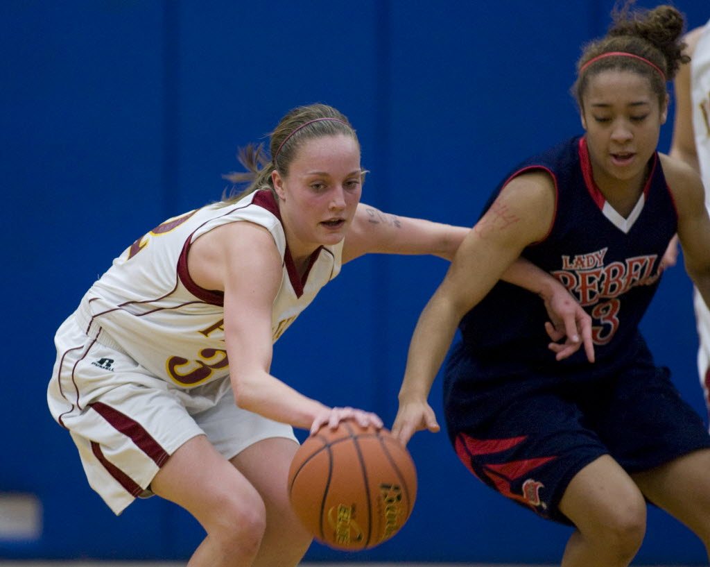 Prairie's Megan Lindsley keeps the ball away from Juanita's Bre Carterin during Saturday's 3A regional game at Rogers High School.