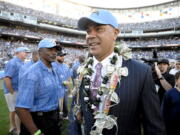 Former San Diego Chargers great Junior Seau smiles during his induction into the Chargers Hall of Fame in San Diego on Nov. 27, 2011. Police say Seau, a former NFL star, was found dead at his home in Oceanside, Calif., Wednesday.