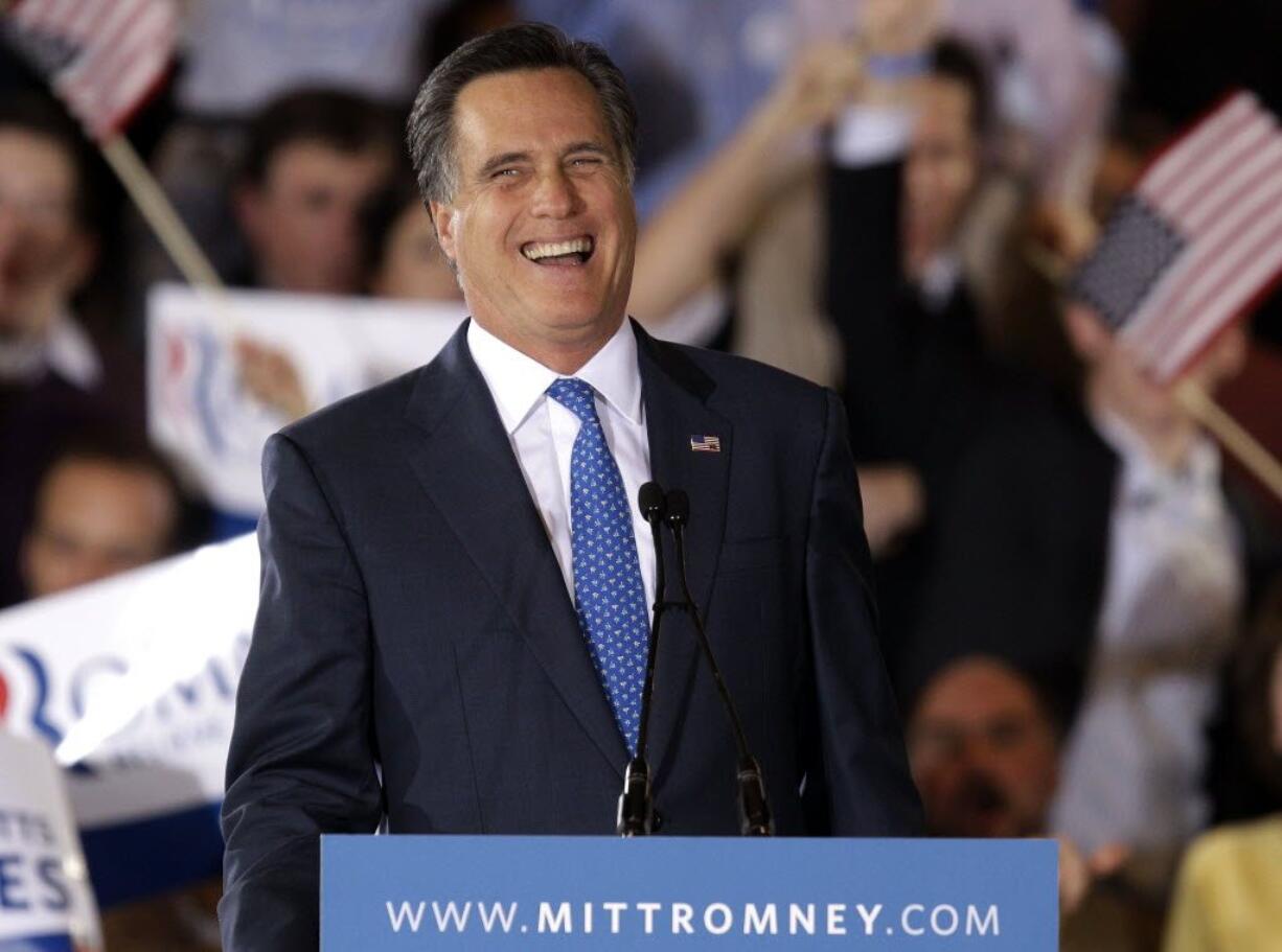 Republican presidential candidate Mitt Romney, former Massachusetts governor, smiles as he addresses supporters at his Super Tuesday campaign rally in Boston on Tuesday.