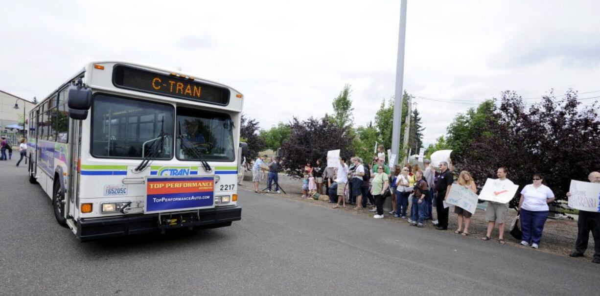 A C-Tran bus passes a group of supporters of Proposition 1 in August as they rally for a C-Tran sales tax increase outside the Clark County Fair. The measure was approved.