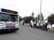 A C-Tran bus passes a group of supporters of Proposition 1 in August as they rally for a C-Tran sales tax increase outside the Clark County Fair. The measure was approved.