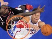 Blake Griffin, right, puts up a shot as Portland's forward J.J. Hickson defends during the first half Friday.