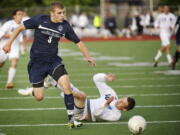 Skyview's Austin Horner, left, sweeps past Cobi Guerrinha of Central Valley as he looks for an opportunity to take a shot on goal Friday at Sparks Stadium in Puyallup.