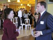 Michelle Platter, founder of Shaping Environments and Chuck Nokes, chief executive officer of REDPoint, talk startups at an April 21, 2010, PubTalk event in Vancouver.