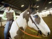 Amber Rios, 19, from Vancouver, competes Sunday in the Craig Cameron Extreme Cowboy Race at the Washington State Horse Expo, held at the Clark County Event Center at the Fairgrounds.