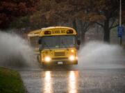 A School bus plunges into standing water on N.E. 136th Ave. near N.E.