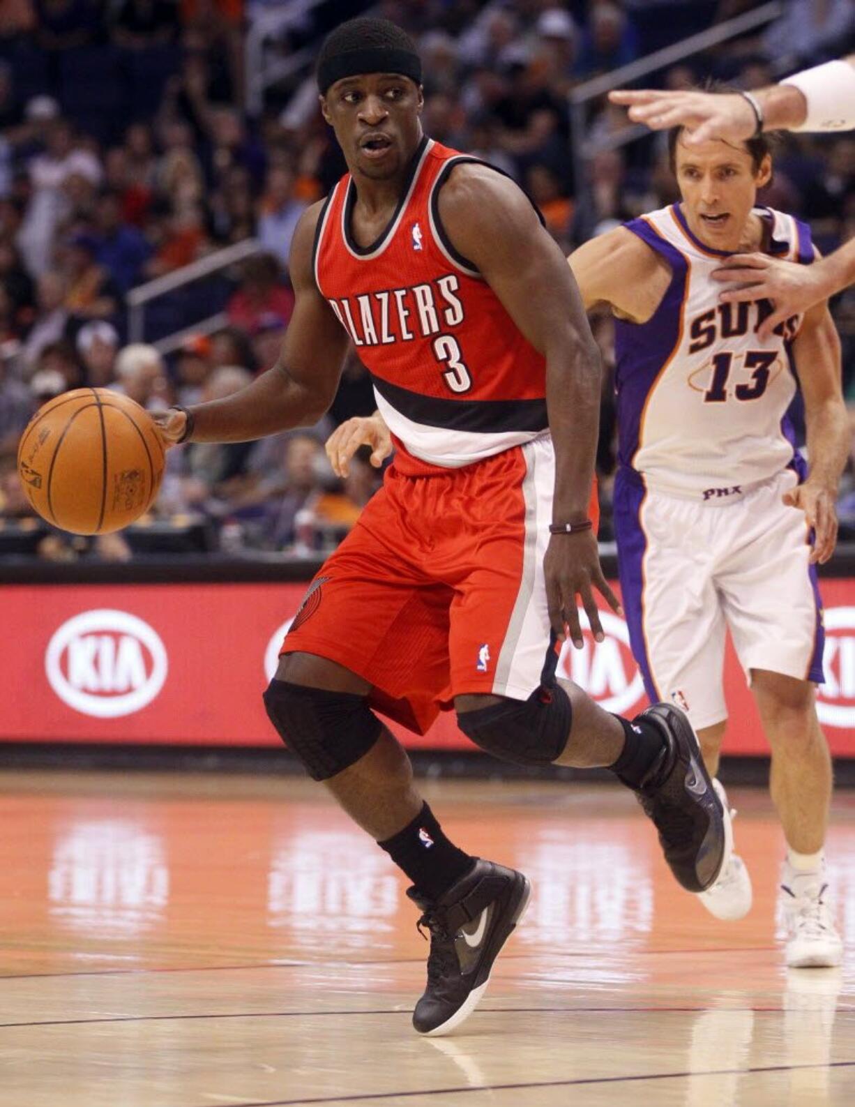 Portland's Jonny Flynn (3) looks to pass as Phoneix Suns' Steve Nash (13) pursues during the first half Monday.