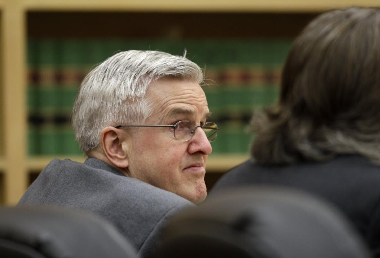 Steve Powell looks toward his attorneys during the day of final arguments in his voyeurism trial Tuesday.