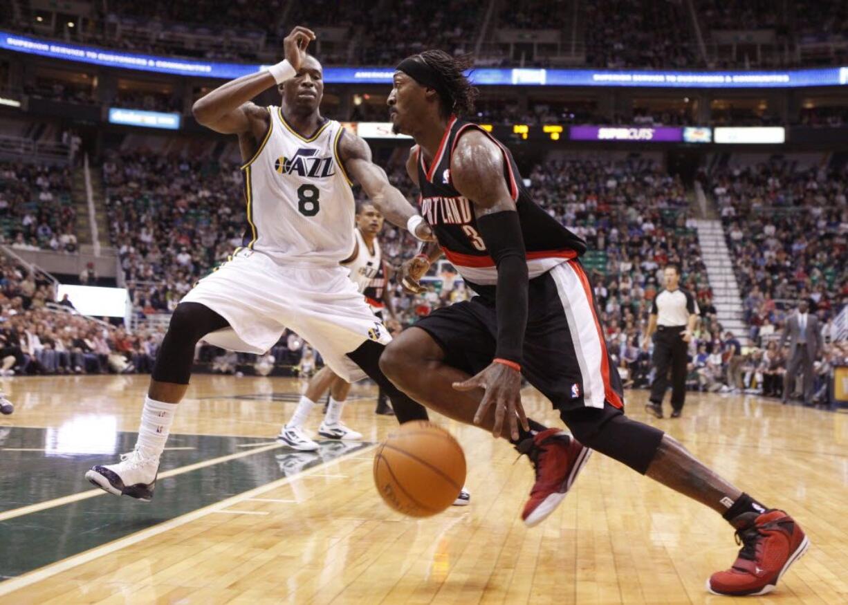 Portland Trail Blazers forward Gerald Wallace (3) drives past Utah Jazz forward Josh Howard (8) during the first half Monday.