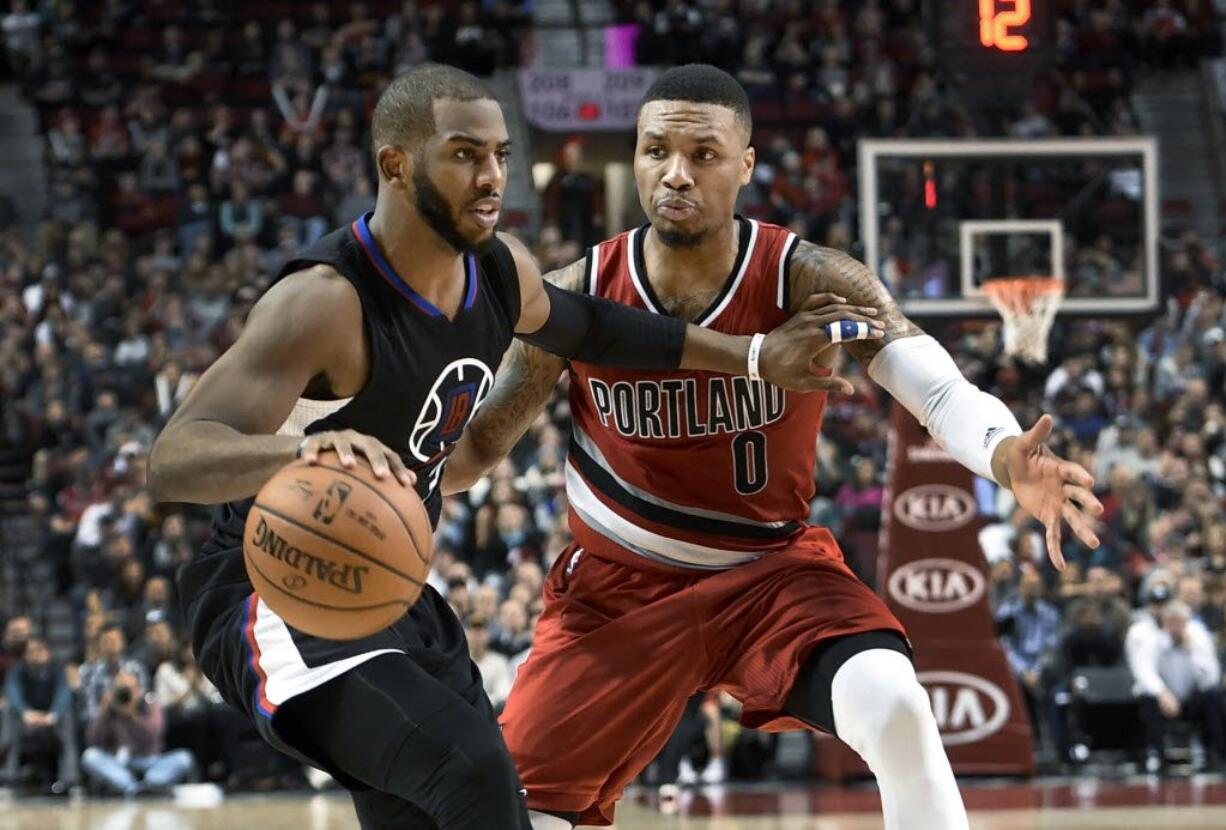 Los Angeles Clippers guard Chris Paul (3) tries to get past Portland Trail Blazers guard Damian Lillard during the second half of an NBA basketball game in Portland, Ore., Wednesday, Jan. 6, 2016. The Clippers won 109-98.