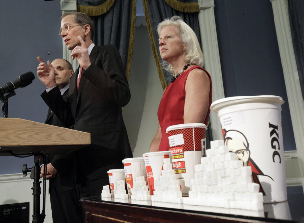 New York City Health Commissioner Thomas Farley, center, accompanied by Deputy Mayor for Health and Human Services Linda Gibbs and Howard Wolfson, Counselor New York Mayor Michael Bloomberg, addresses a news conference at New York's City Hall Thursday.