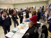 Veterans look for work at a job fair sponsored by WorkSource at the new Armed Forces Reserve Center on November 17.