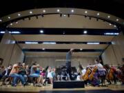 Dr. Salvador Brotons leads the Vancouver Symphony in a rehearsal at Skyview High School on Sept. 30, 2010.