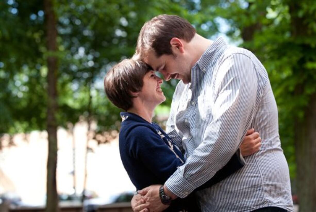 This May 25, 2012, photo, shows actor Isaac Lamb and Amy Frankel in Portland, Ore. Lamb joined about 60 people on a small street near his house last week to propose to Frankel. He's pitching it as the world's first lip-synched proposal and there don't appear to be any challengers.