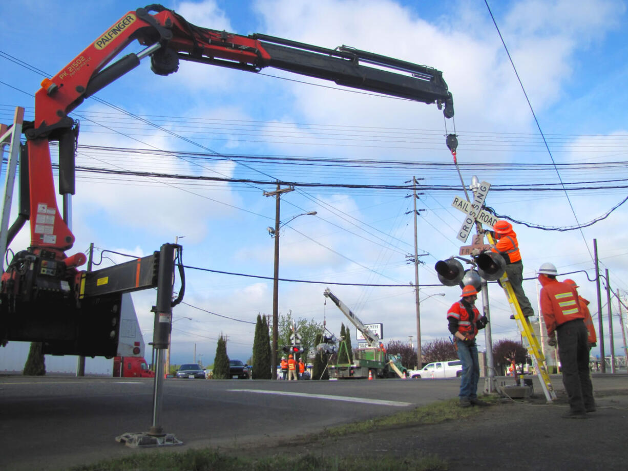 BNSF Railway crews replaced crossing signals in downtown Vancouver Friday, April 13.