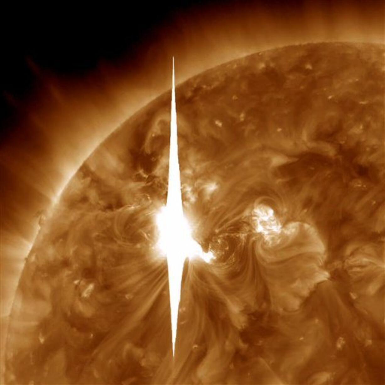 An impressive solar flare is heading toward Earth and could disrupt power grids, GPS and airplane flights.