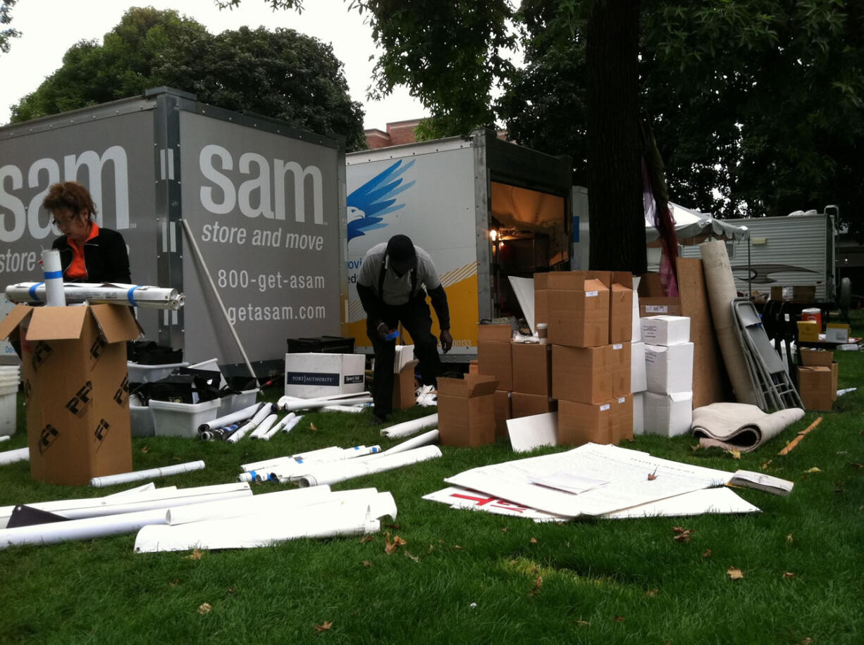 Workers clean up Vancouver's Esther Short Park on Monday after last weekend's Vancouver Wine &amp; Jazz Festival.