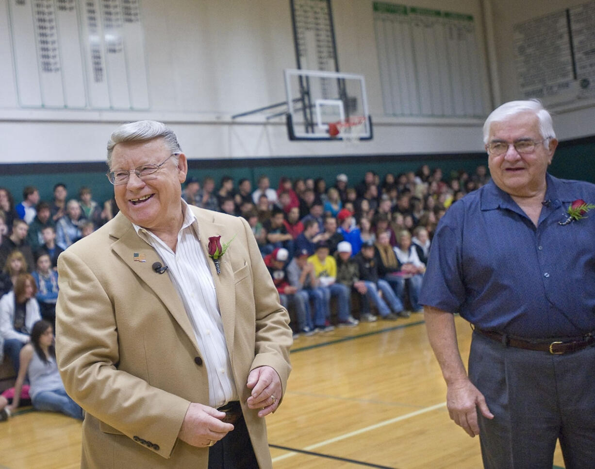 Scott Perry, left, reacts after winning a coin toss and the Woodland City Council race over Robert Ripp, right, at Woodland High School on Wednesday December 7, 2011.