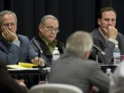 Clark County Commissioners, from left, Marc Boldt, Tom Mielke and Steve Stuart, listen to BPA Administrator Steve Wright during a meeting last year.